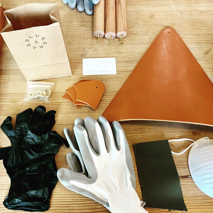 white gloves near wooden rods