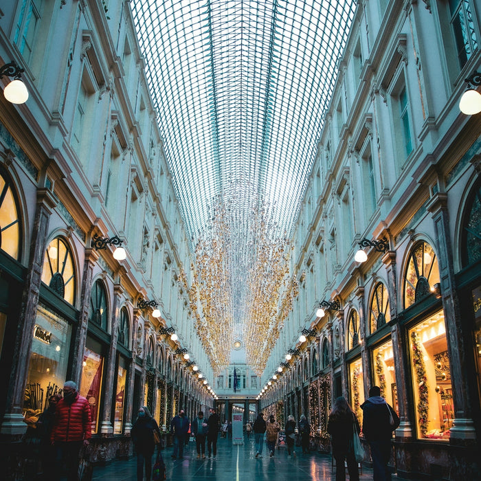 people walking on street between buildings during daytime