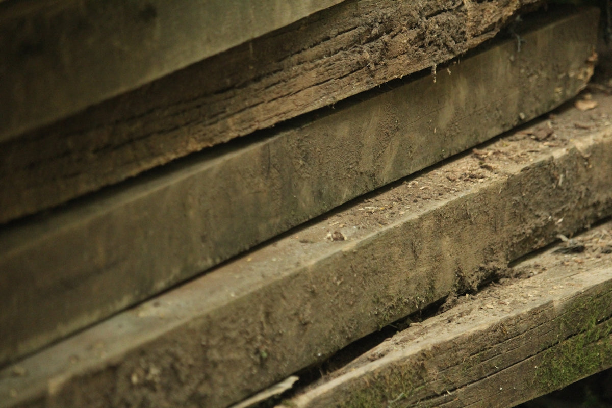 a close up of a bench made of wood