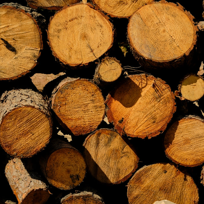 a pile of wood that is cut in half