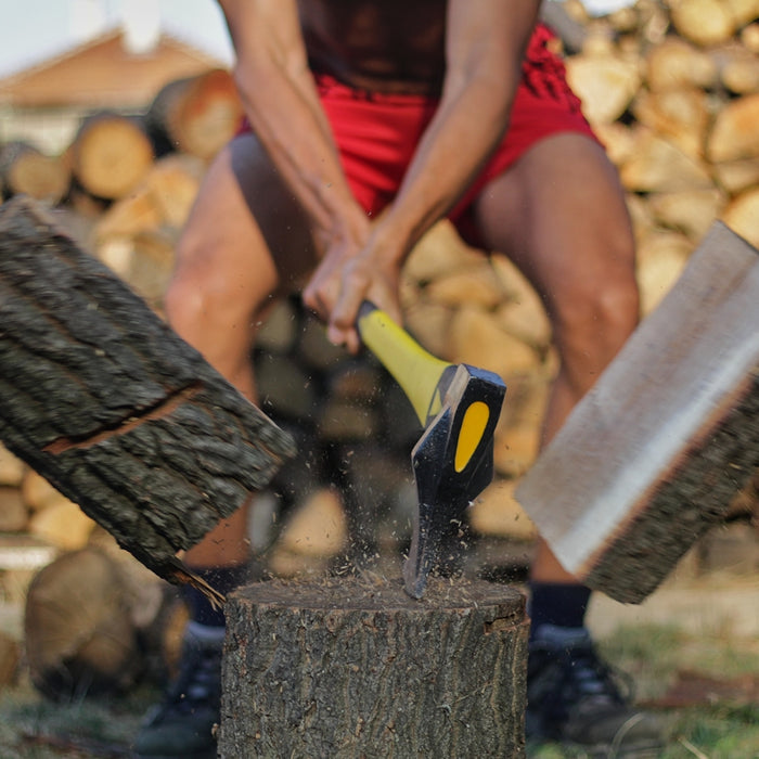 a person cutting wood with scissors