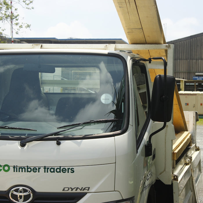 White truck with eco timber traders logo on it