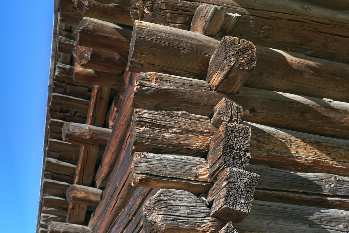A close up of a wooden building with a blue sky in the background