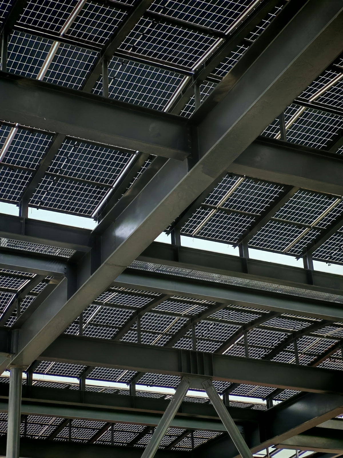 Solar panels are installed on a steel-framed roof.
