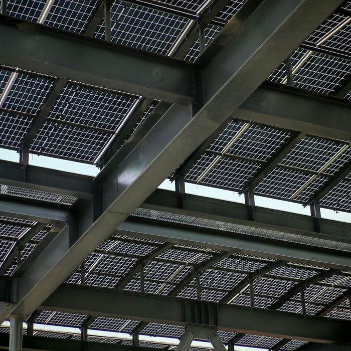 Solar panels are installed on a steel-framed roof.