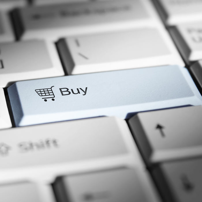 Close-up of a keyboard with a prominent 'buy' button.