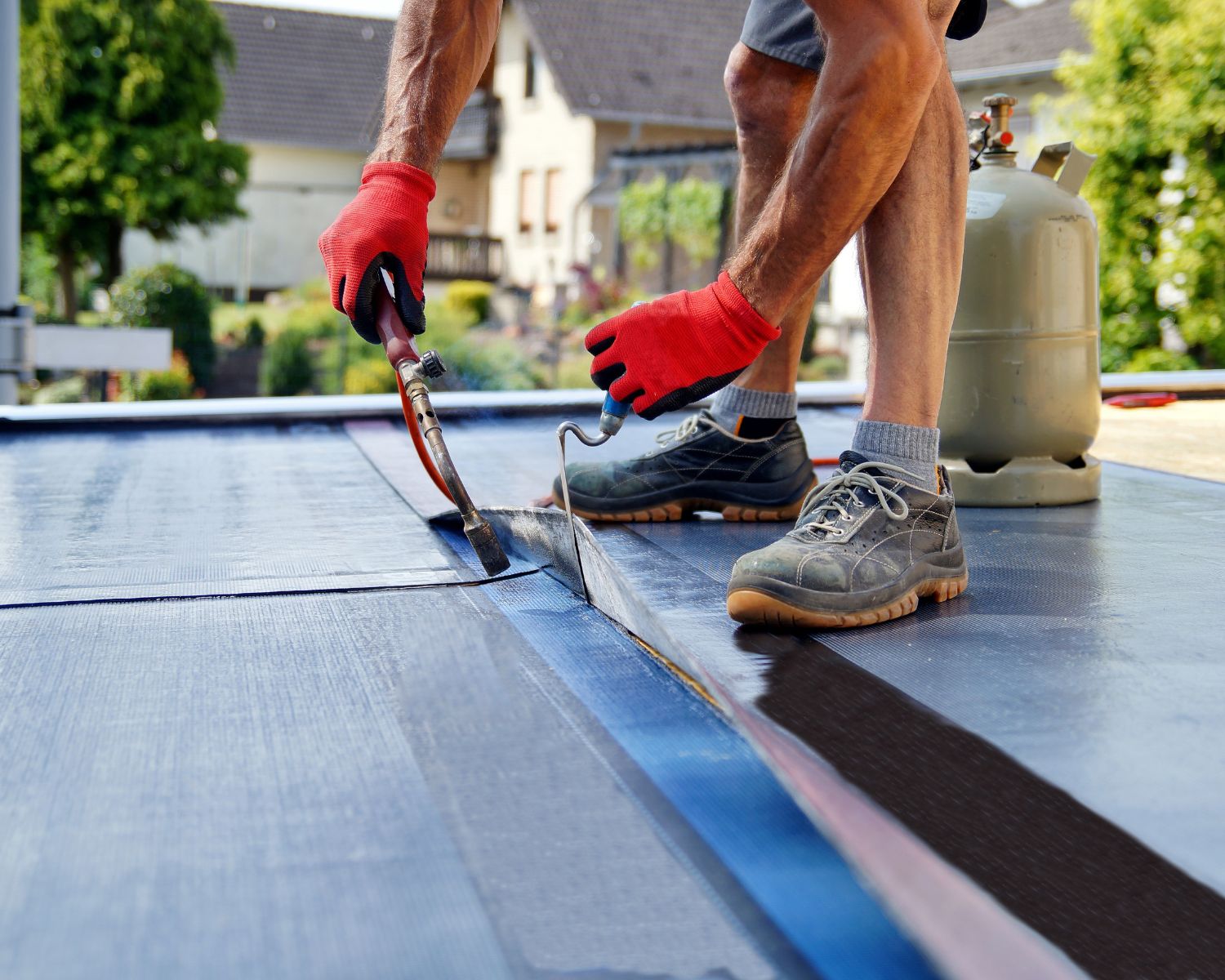 heating and gluing roofing felt